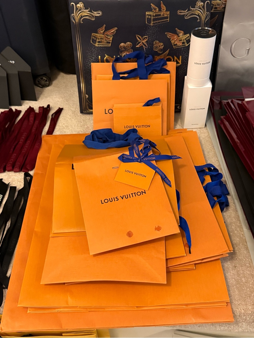 Louis Vuitton Orange Gift Bags with Blue Ribbon Accents
